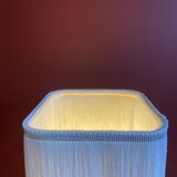 Beige marble stucco base, Houles white ecru fringed lampshade.