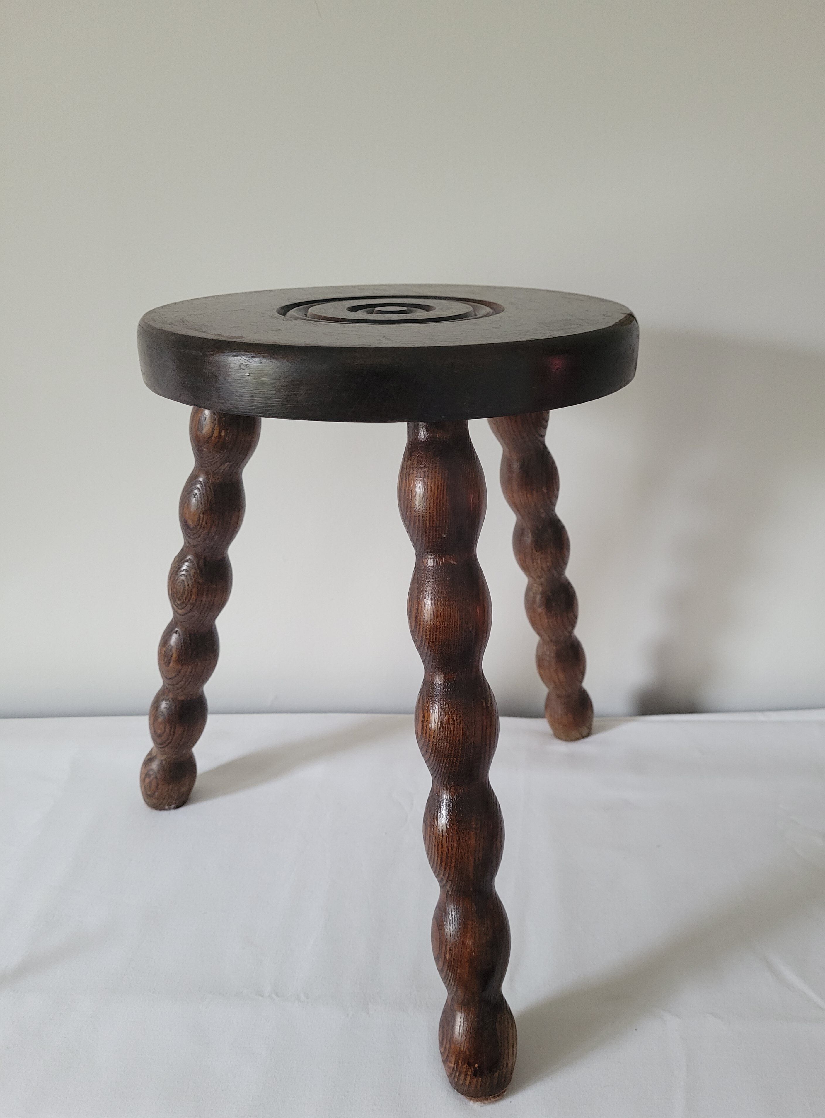 Brutalist stool with turned wooden legs