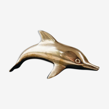 Dolphin in golden brass