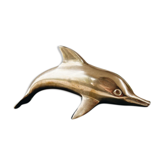 Dolphin in golden brass