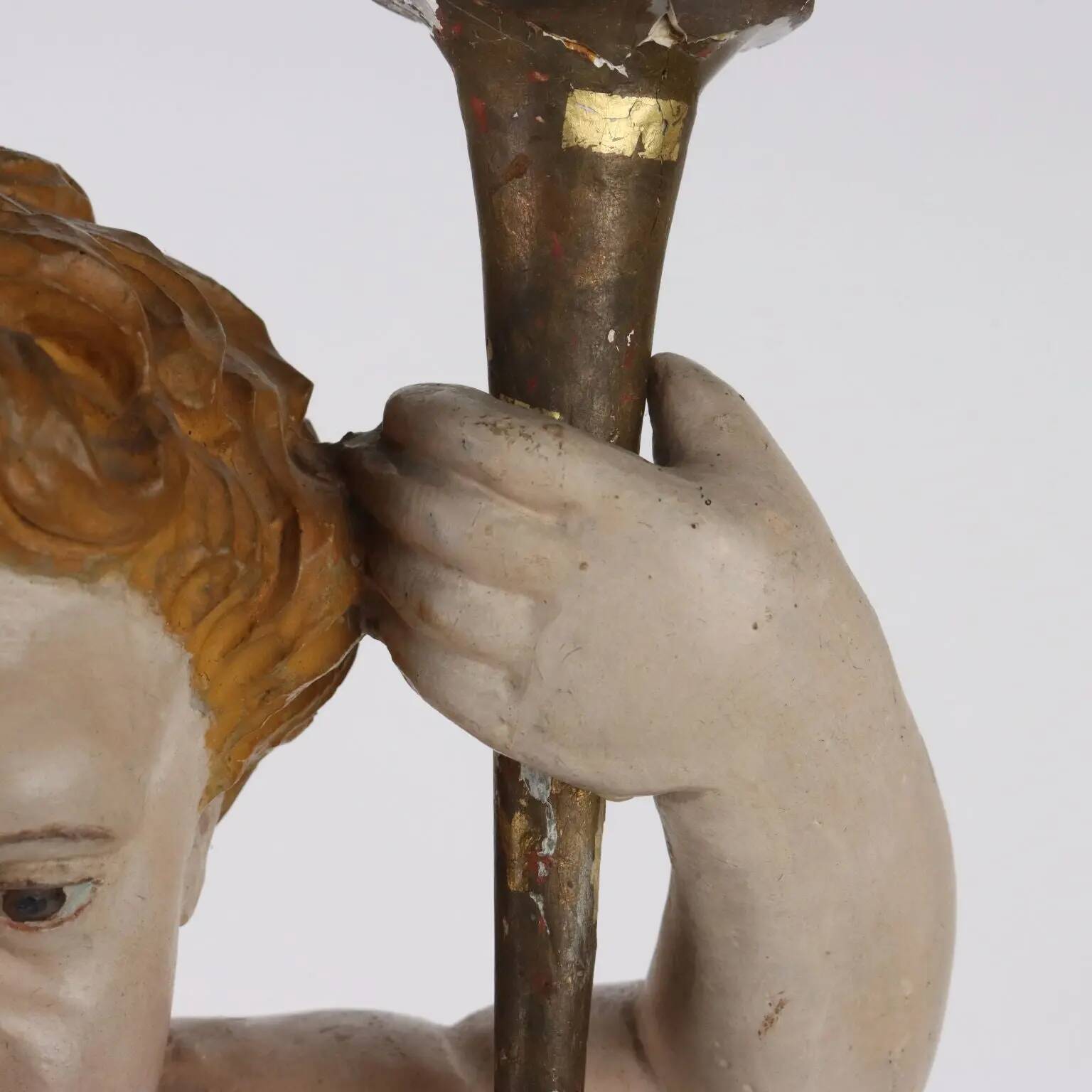 Ancient sculpture of a putto in carved and gilded wood, Italy, 19th century.
