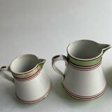 Series of 4 small pitchers.