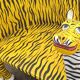 Wooden armchair with a "tiger" appearance.