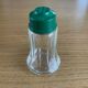 Vintage salt shaker with green Bakelite cap
