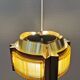Danish hanging lamp, made in brass colored and brown metal, with yellowish hard pressed plastic deta