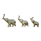 Three brass elephants