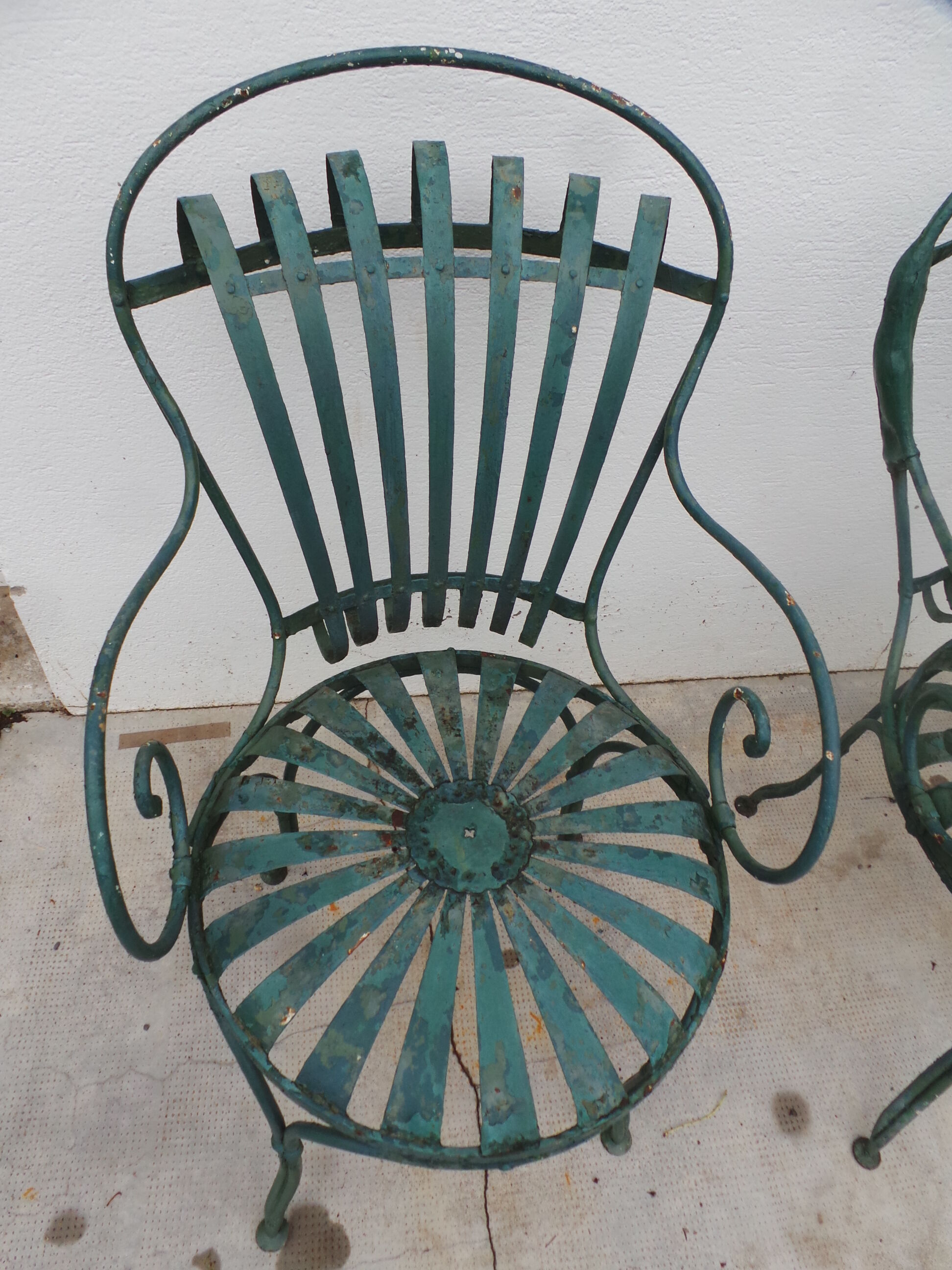 Pair of wrought iron garden chairs by François Carre