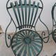 Pair of wrought iron garden chairs by François Carre
