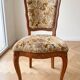 Oval table and 4 chairs in Louis XV style made of wood.