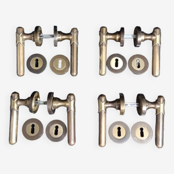 Four pairs of brass door handles with key plates