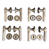 Four pairs of brass door handles with key plates