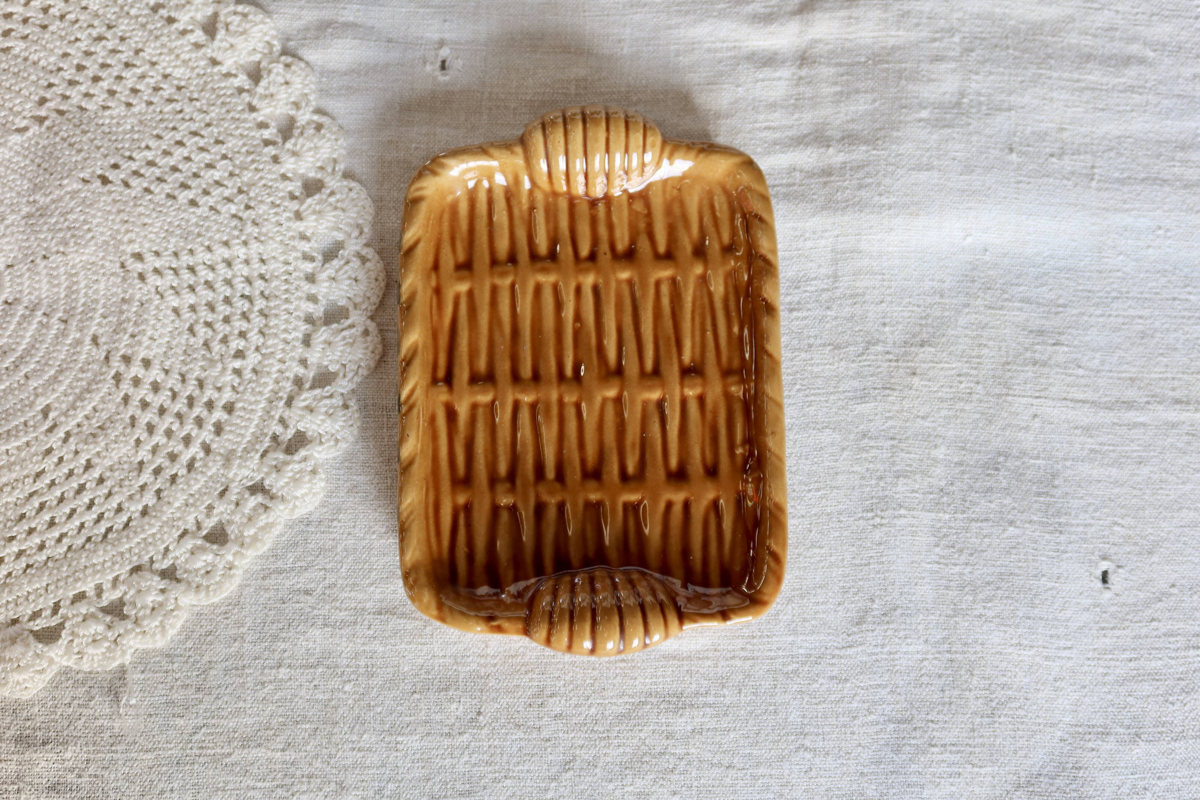 Vintage ceramic trinket dish in mustard color with a braided effect