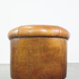 Sheep leather club chair in a cognac color with patina