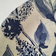 Two flat plates in earthenware with blue floral decoration.