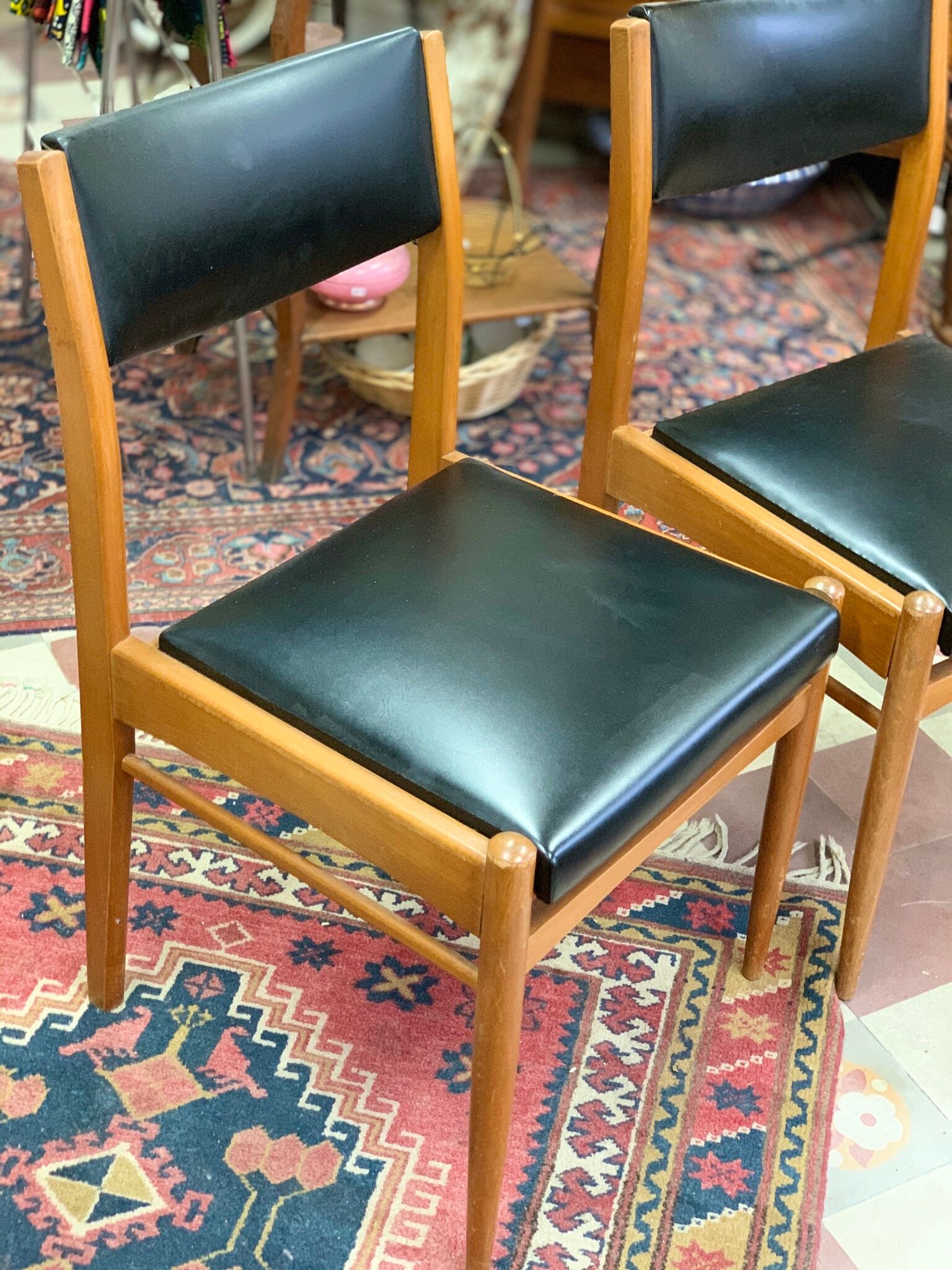 2 Scandinavian-style natural wood chairs, black trim