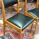 2 Scandinavian-style natural wood chairs, black trim