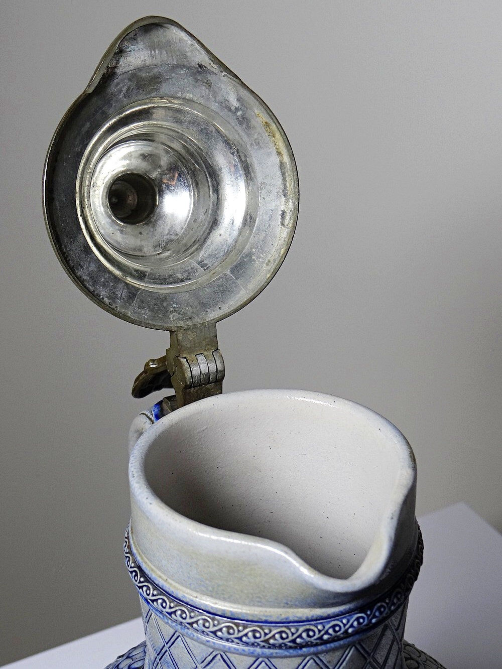 Large salt-glazed stoneware beer jug with tin, Germany, Westerwald type.