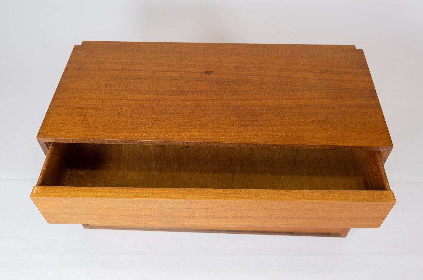 Wall mounted cabinet in teak of danish design from the 1960s.