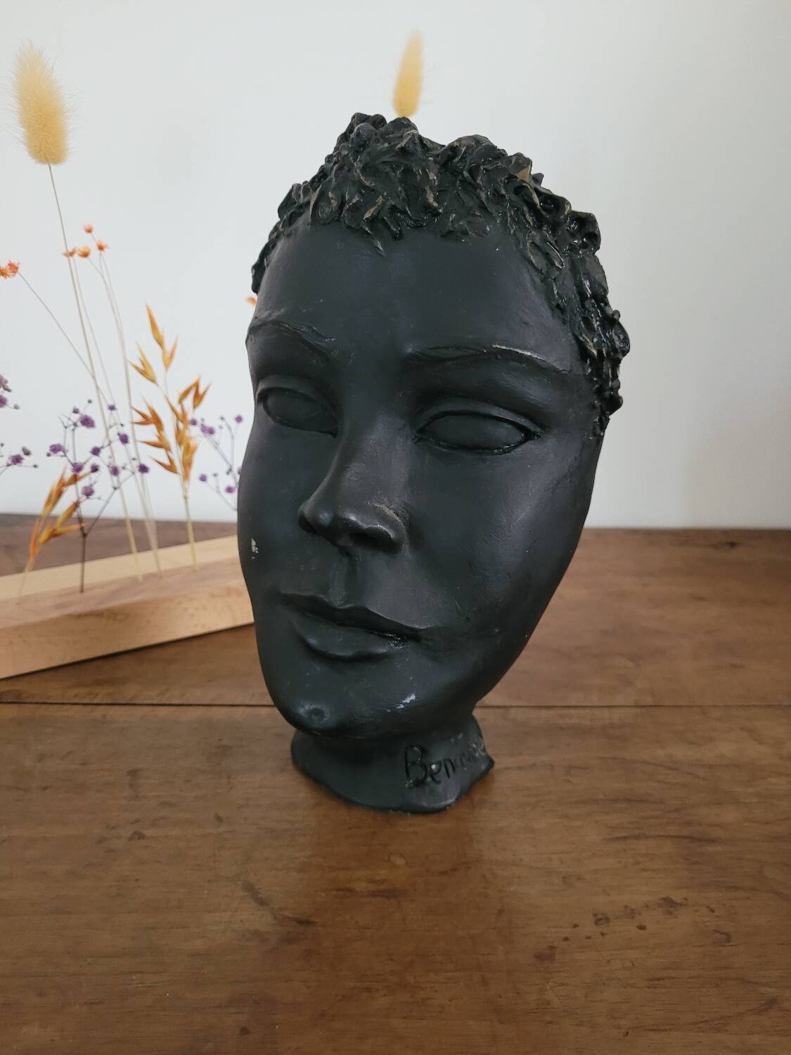 Black ceramic face sculpture