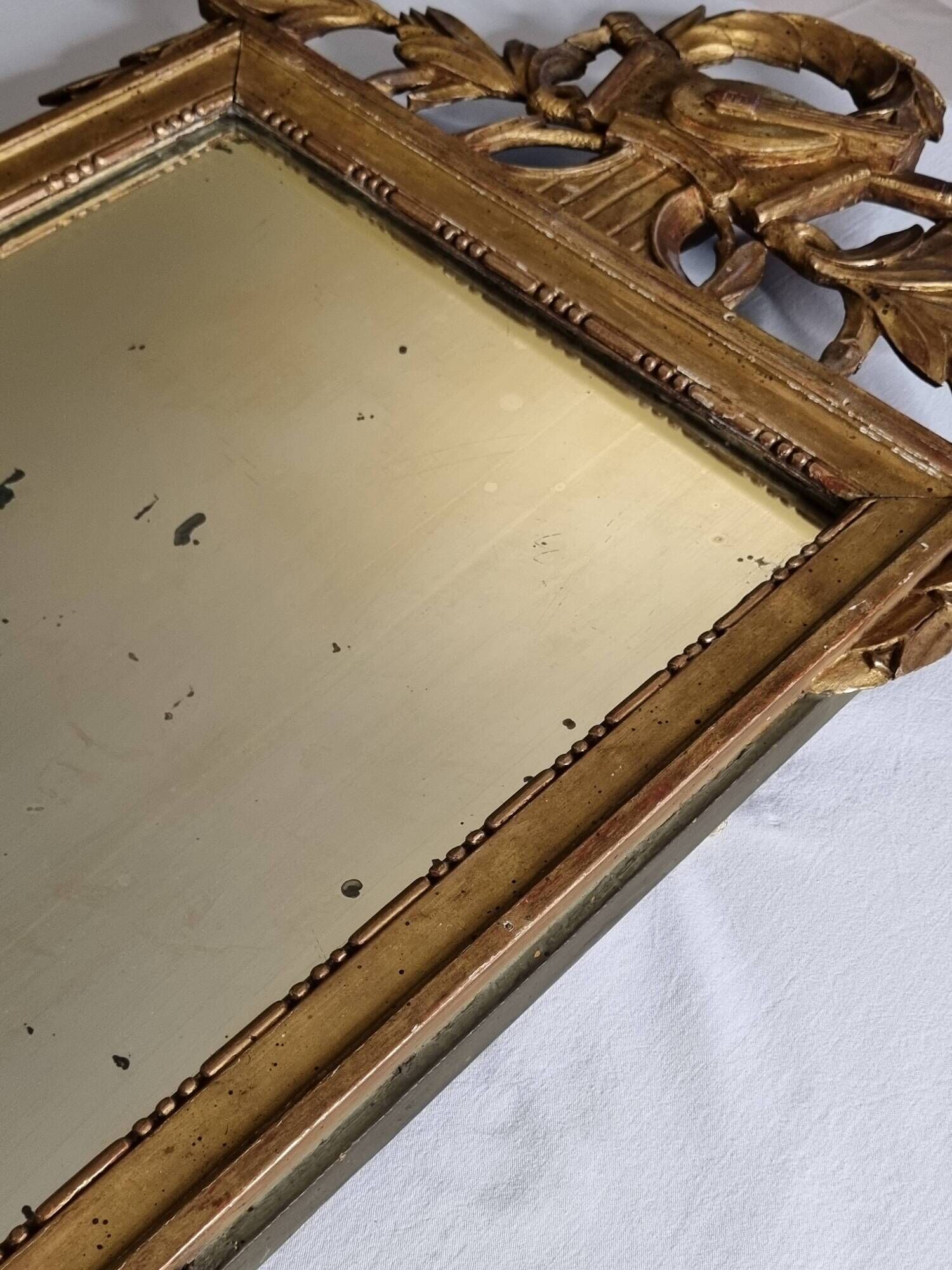 Antique carved and gilded wooden mirror, Louis XVI style – 54 x 92 cm