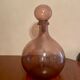 Bottle  in blown and bubbled glass