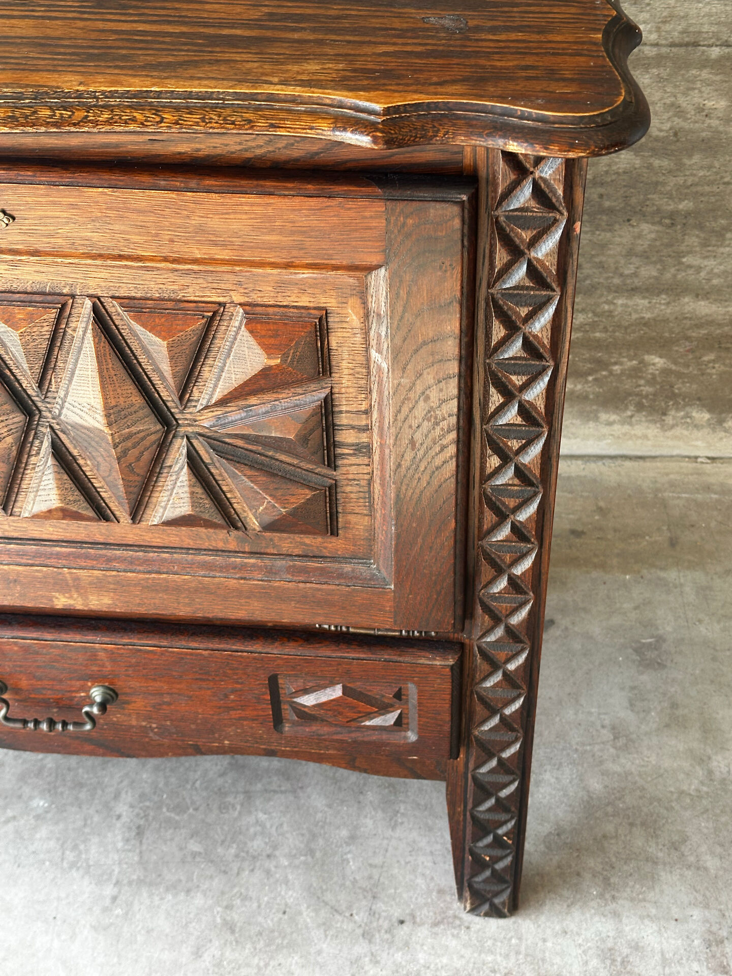 Small storage cabinet in carved oak – circa 1930