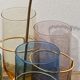 Crystal coloured water glasses in gilded metal glass holders 1970