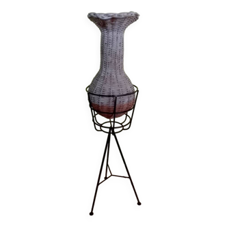 Wicker vase and black metal stand