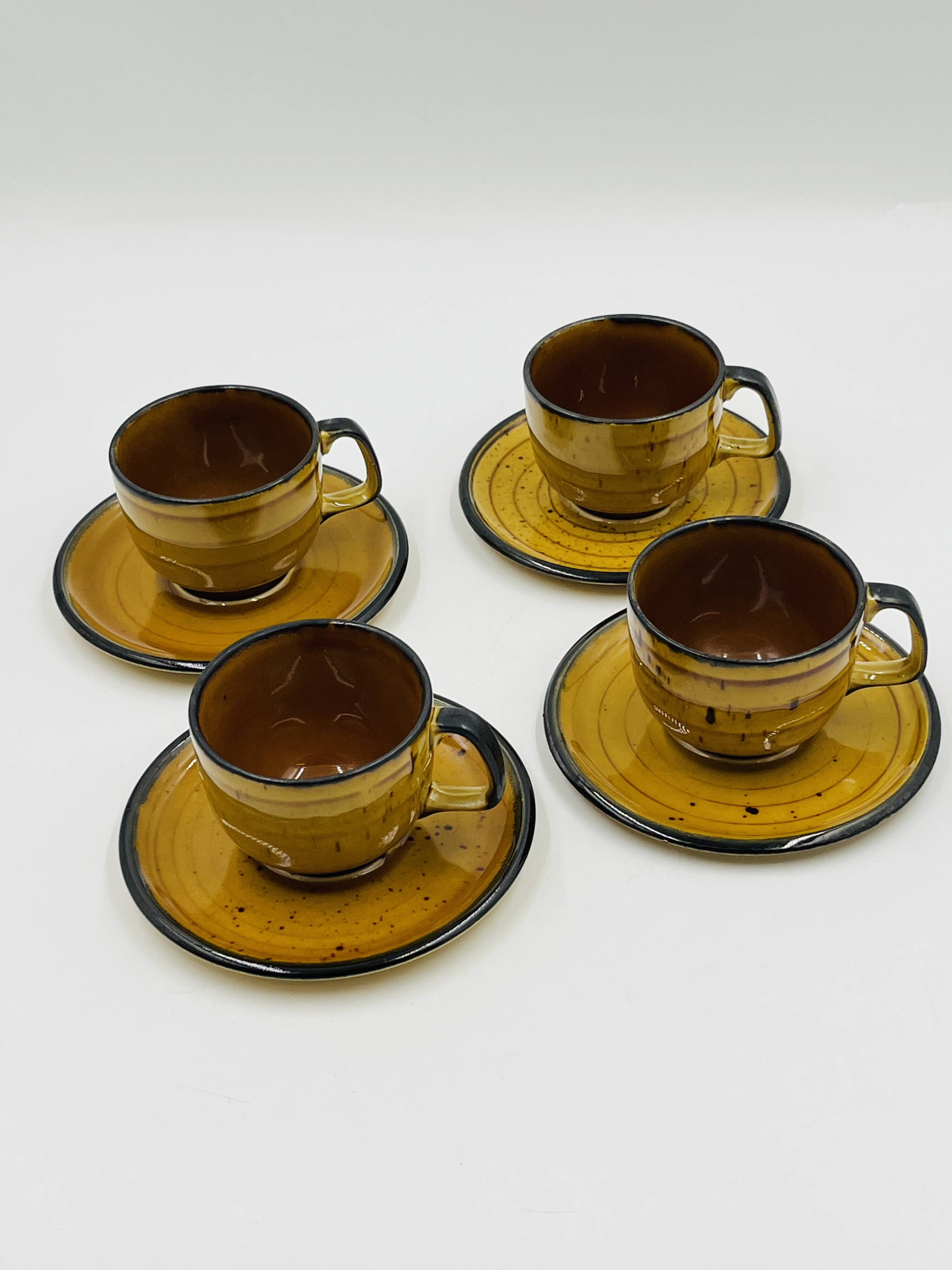 Set of four vintage Boch Palma cups and saucers.