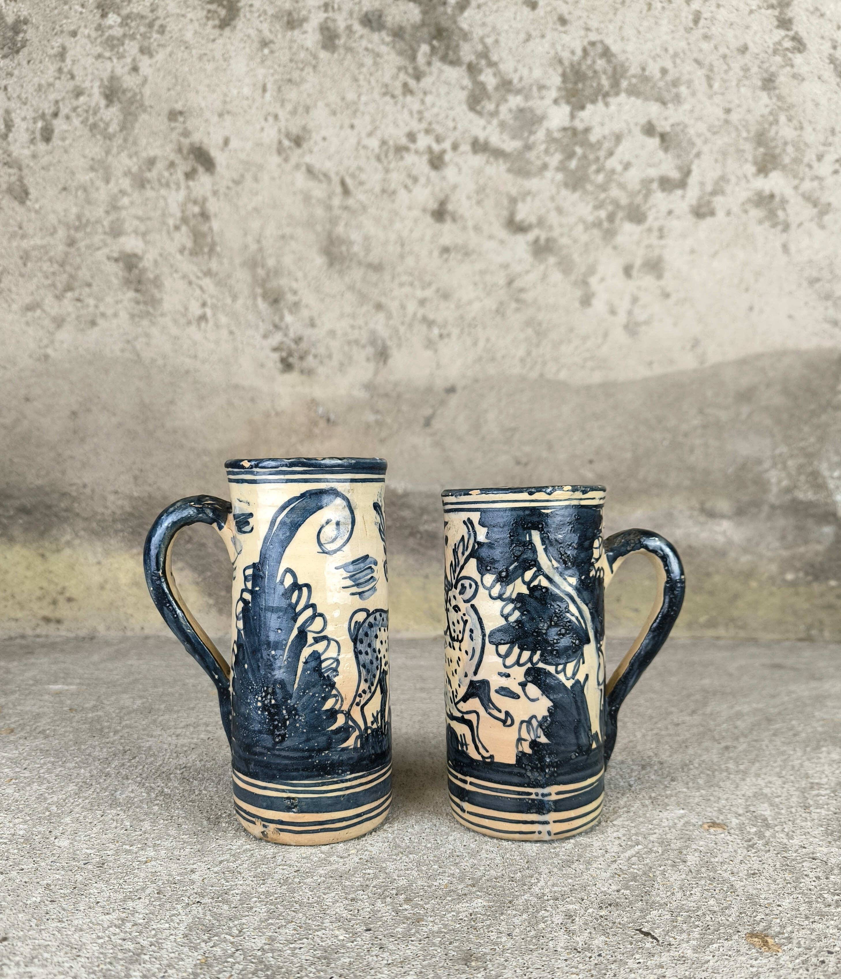 Set of two large vintage glazed terracotta mugs.
