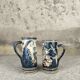 Set of two large vintage glazed terracotta mugs.