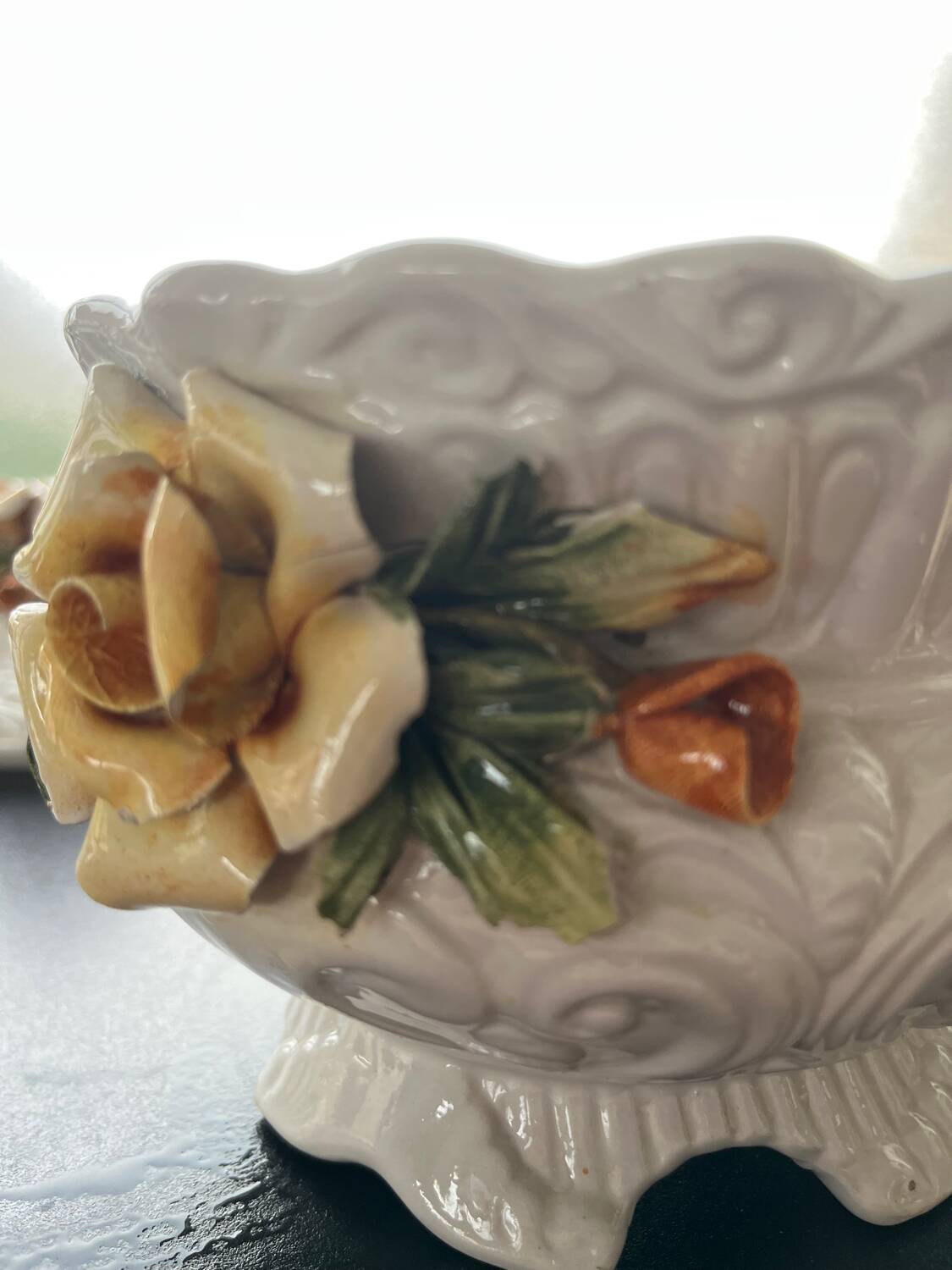 Capodimonte-style porcelain lidded sugar bowl with floral relief