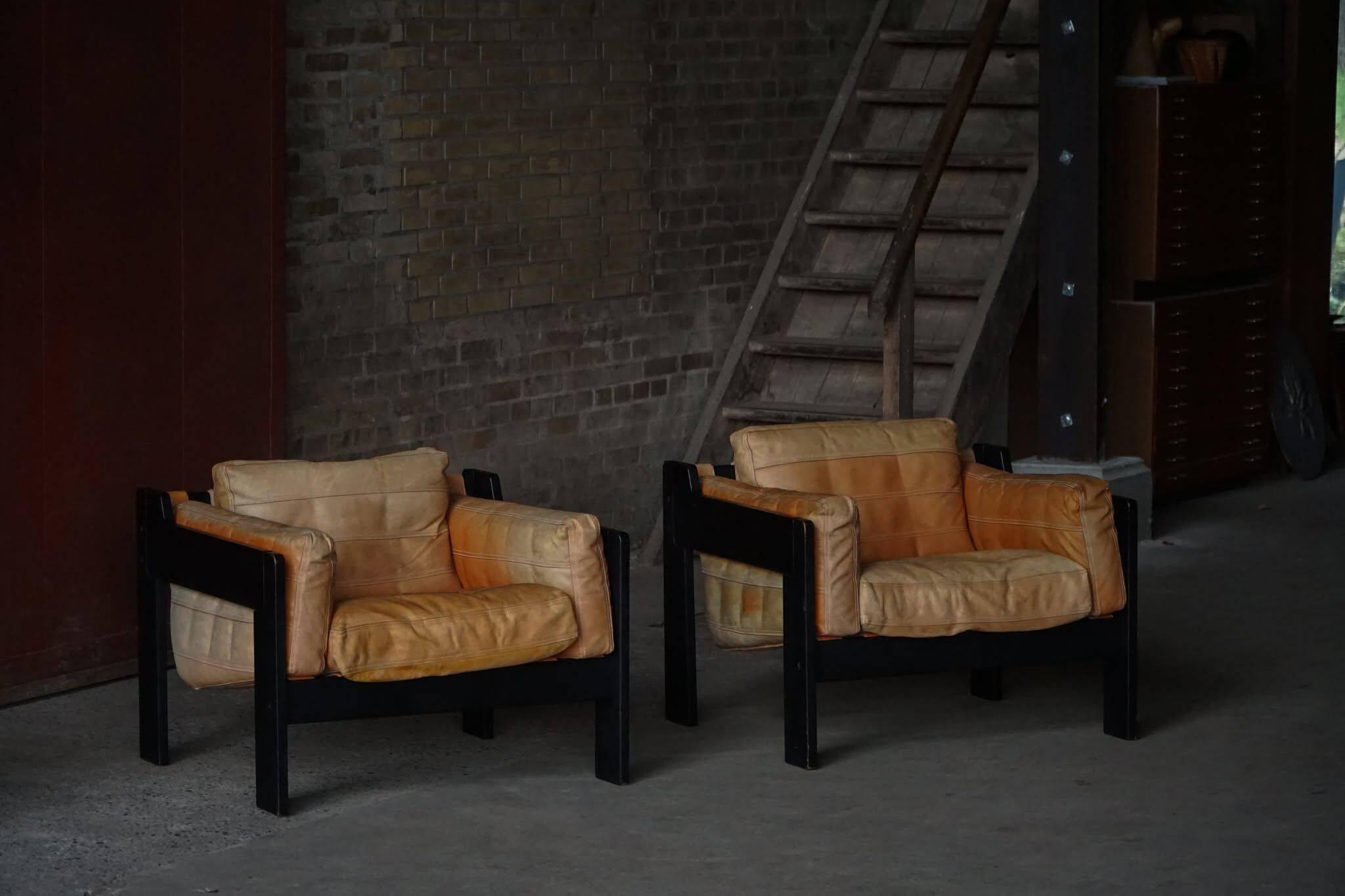Pair of wooden and leather armchairs by Rud Thygesen & Johnny Sørensen, 1970s.