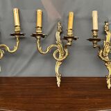 Set of three bronze wall sconces.