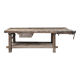 Antique wooden workbench with a vice and drawer.