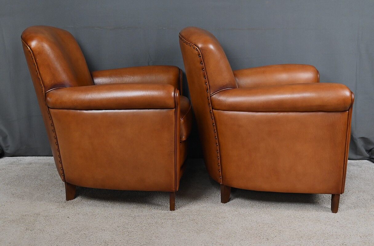 Paire de fauteuils club en cuir