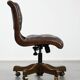 Chesterfield office chair in English style made of cow leather and wood.