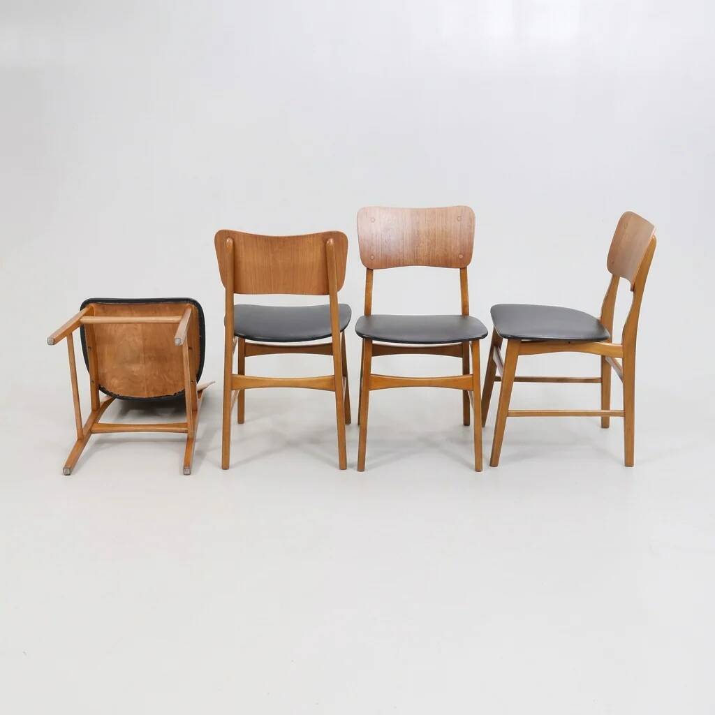 Set of 2 vintage Scandinavian chairs in teak and black faux leather by Kofod-Larsen, Denmark, 1960s.