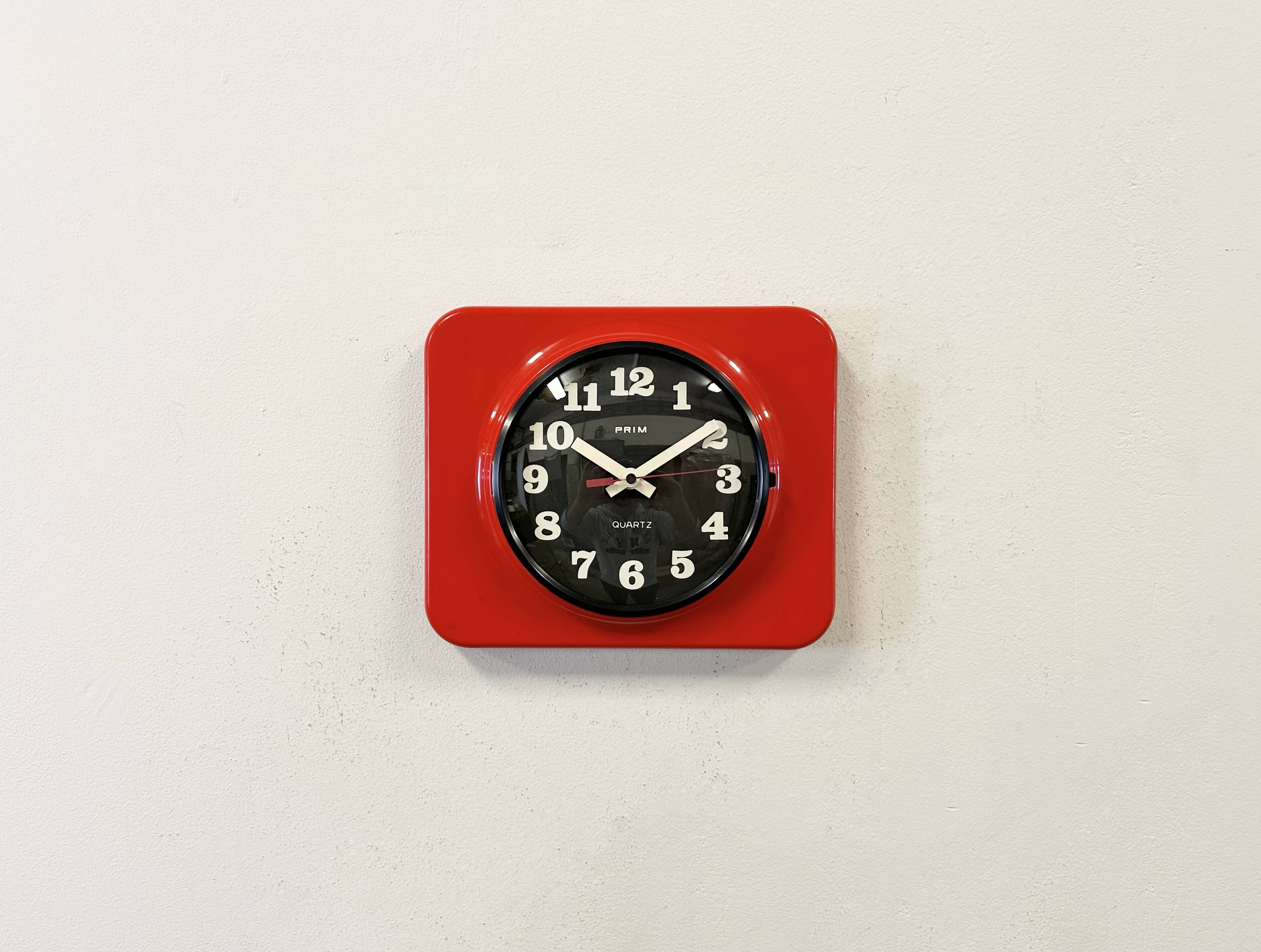 Vintage red bakelite wall clock from prim, 1970s