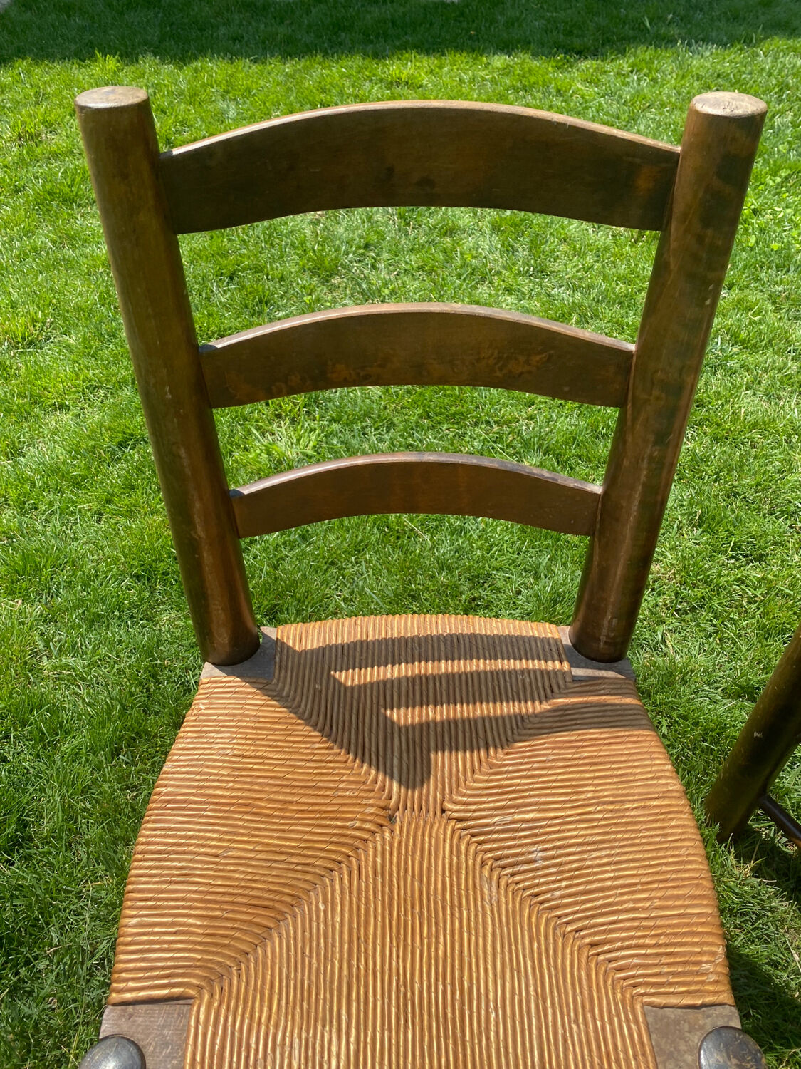 Pair of Georges Robert straw chairs