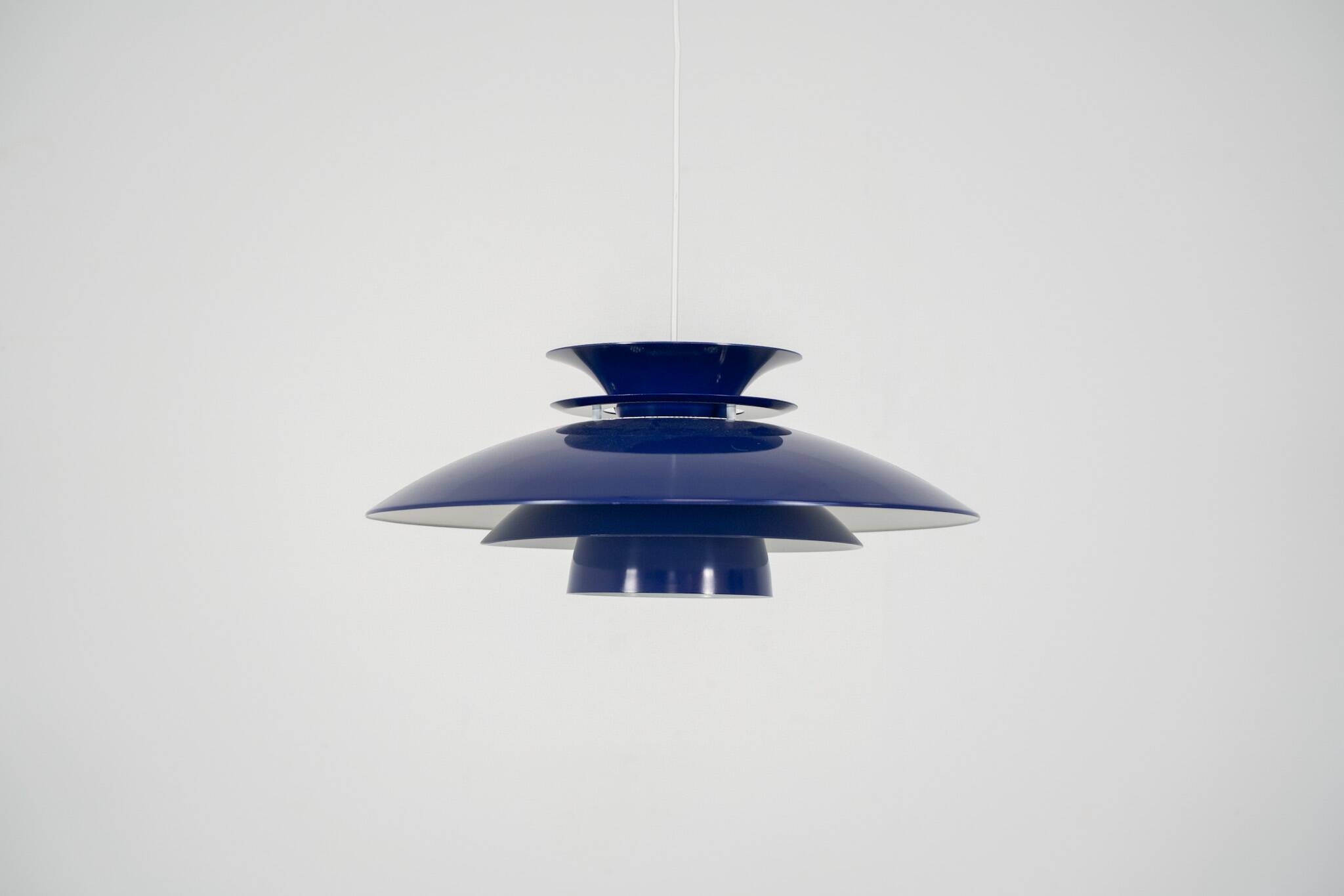 Elegant blue pendant light by Belux