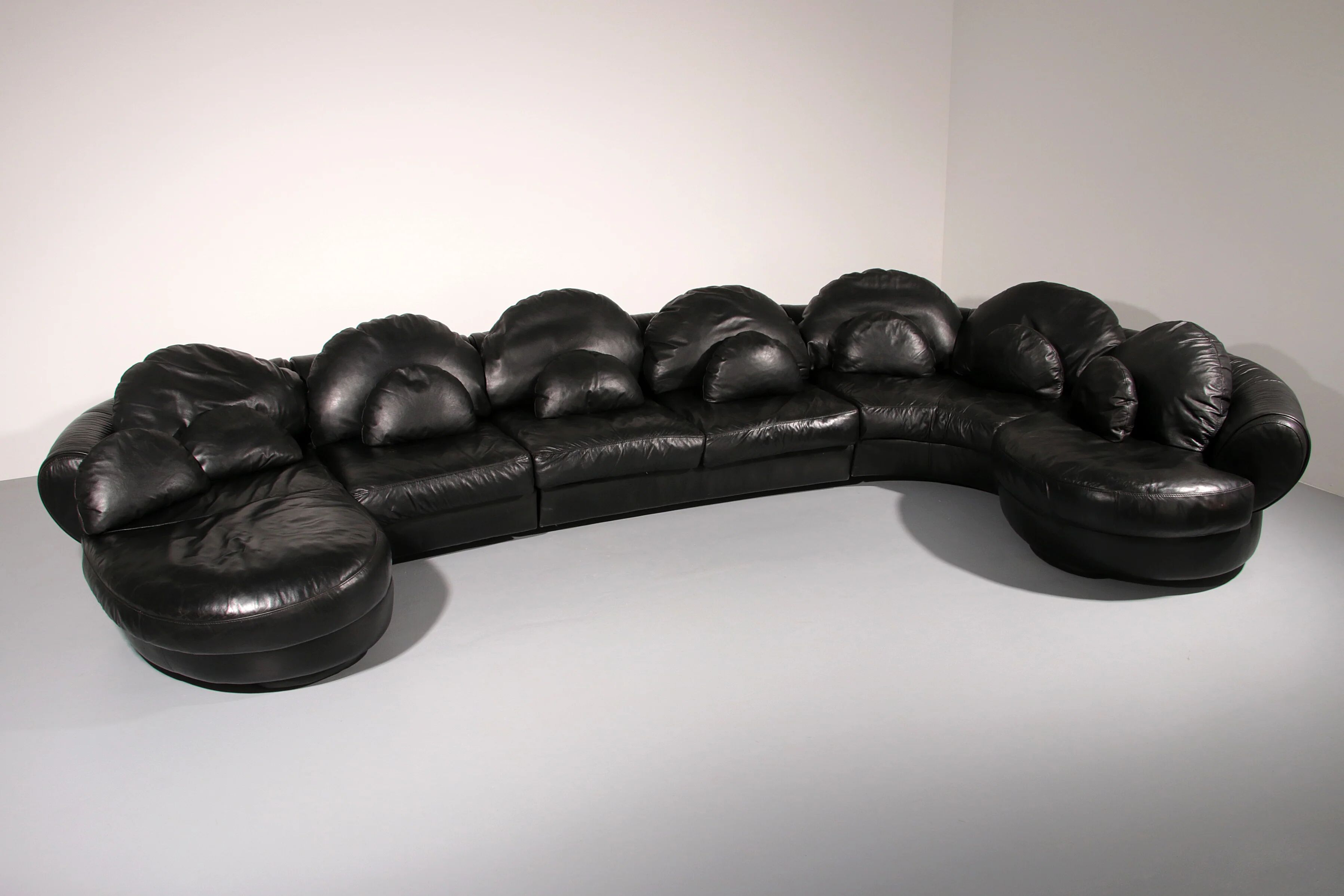 Organically shaped post-modern sectional sofa in black leather