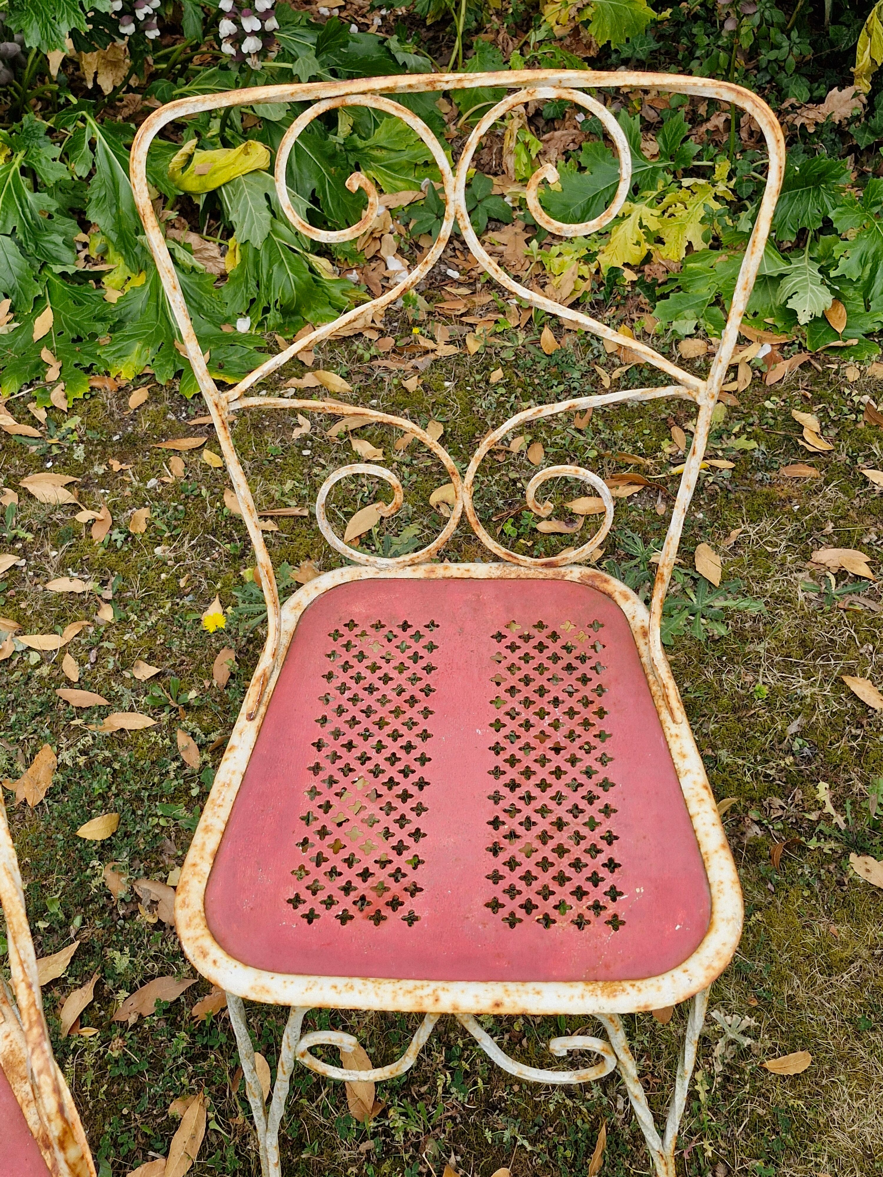 Perforated metal garden chairs and armchairs