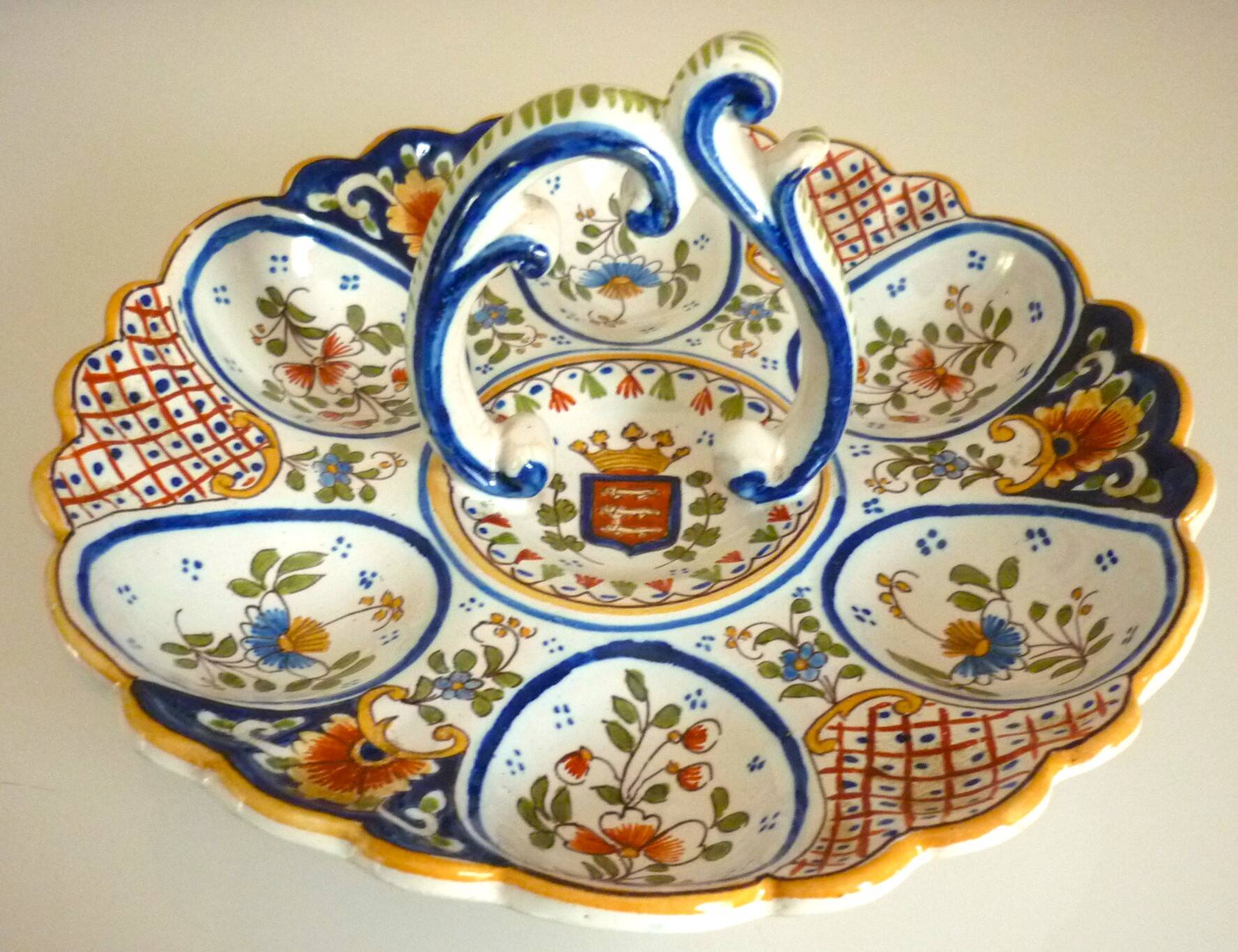 Dish, egg server in hand-painted earthenware, signed Geo Martel