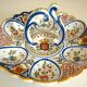 Dish, egg server in hand-painted earthenware, signed Geo Martel