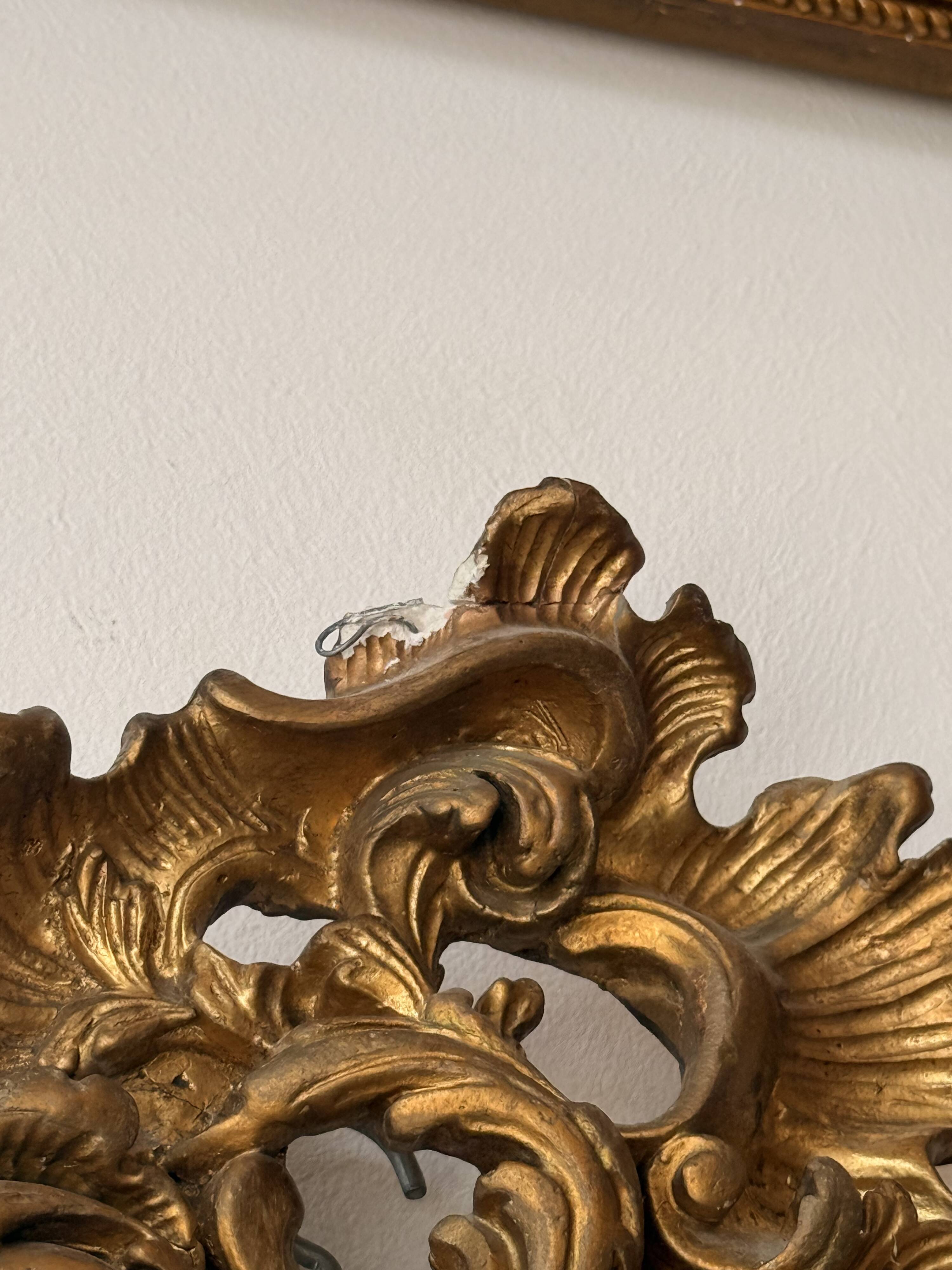 Large antique Louis XV style mirror in gilded wood.
