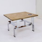 Acid-etched brass coffee table top by Christian Krekels with an agate stone
