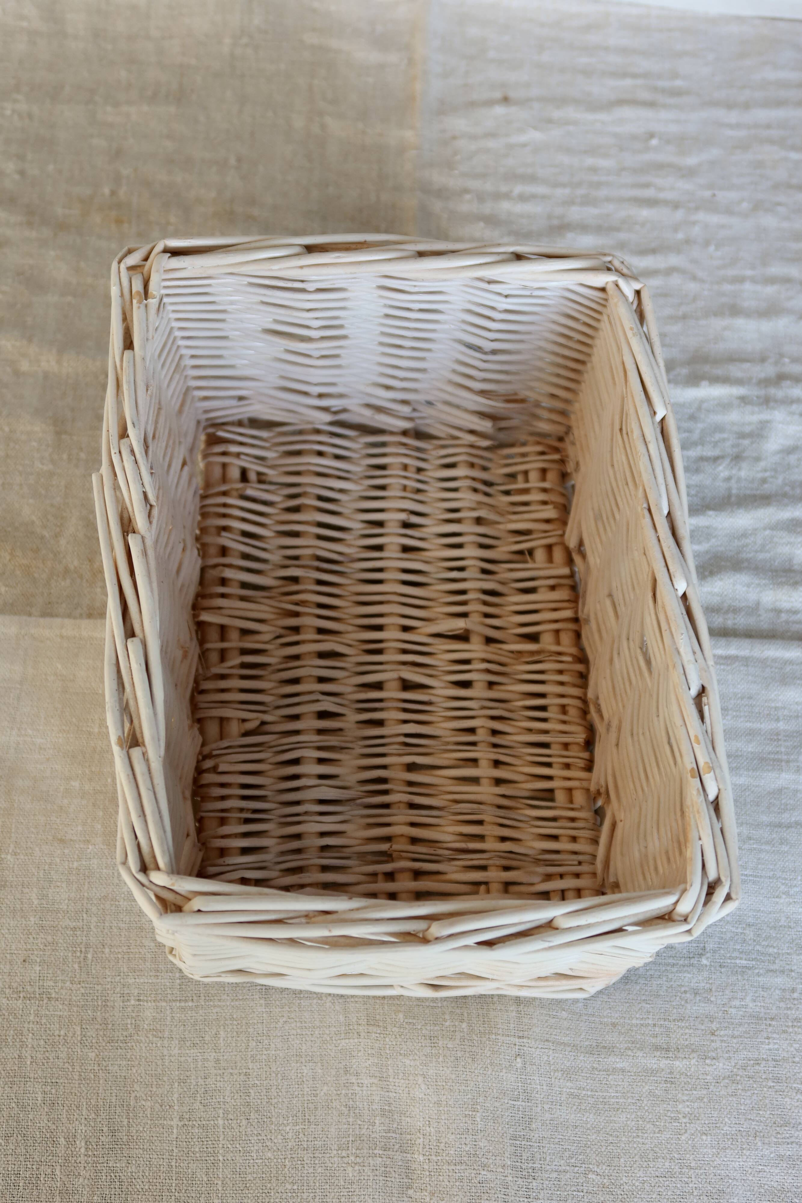 Vintage white wicker storage baskets