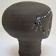 Anthropomorphic candle holder, scarified ceramic, stamped design