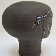 Anthropomorphic candle holder, scarified ceramic, stamped design